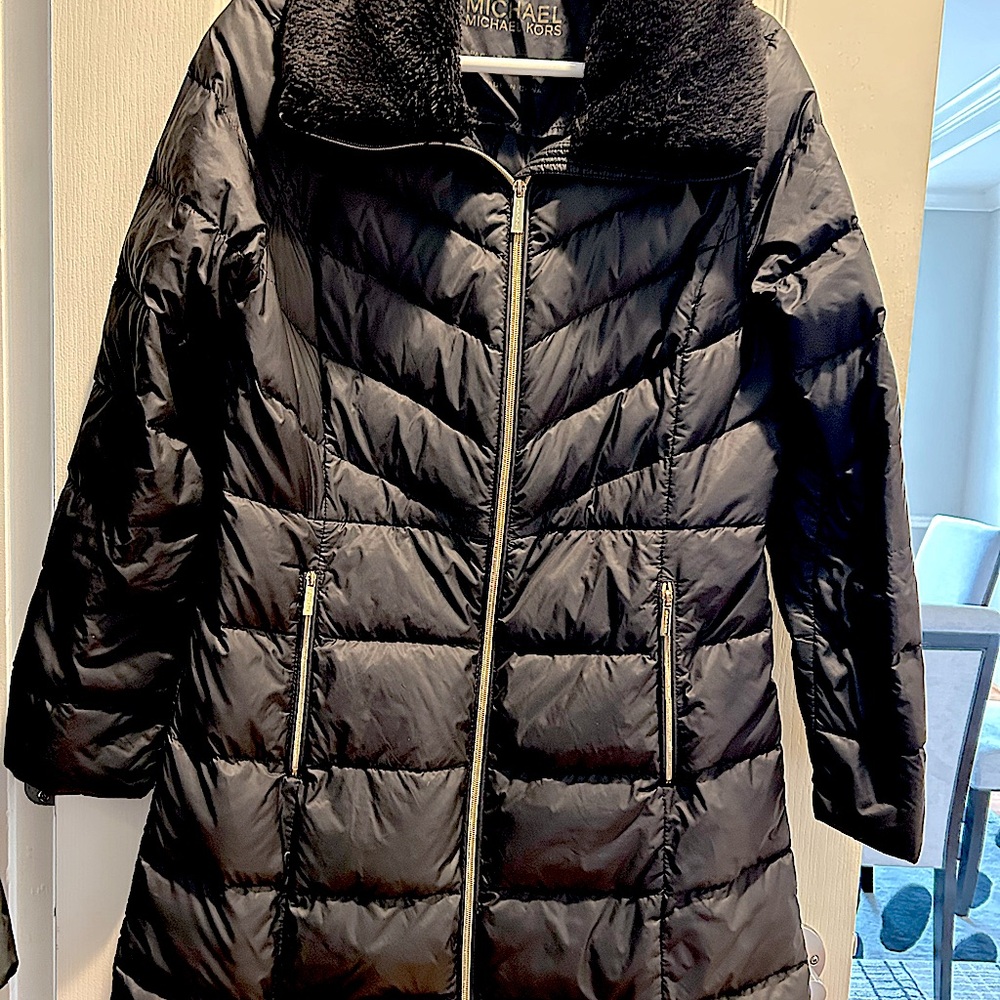 Michael Kors puffer coat. Line new. Black with warm fake fur collar.